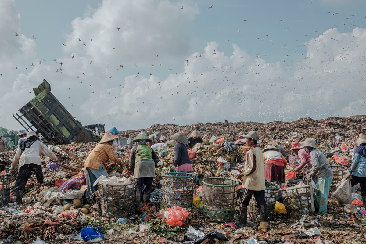 Informal recyclers sorting plastic at a landfill